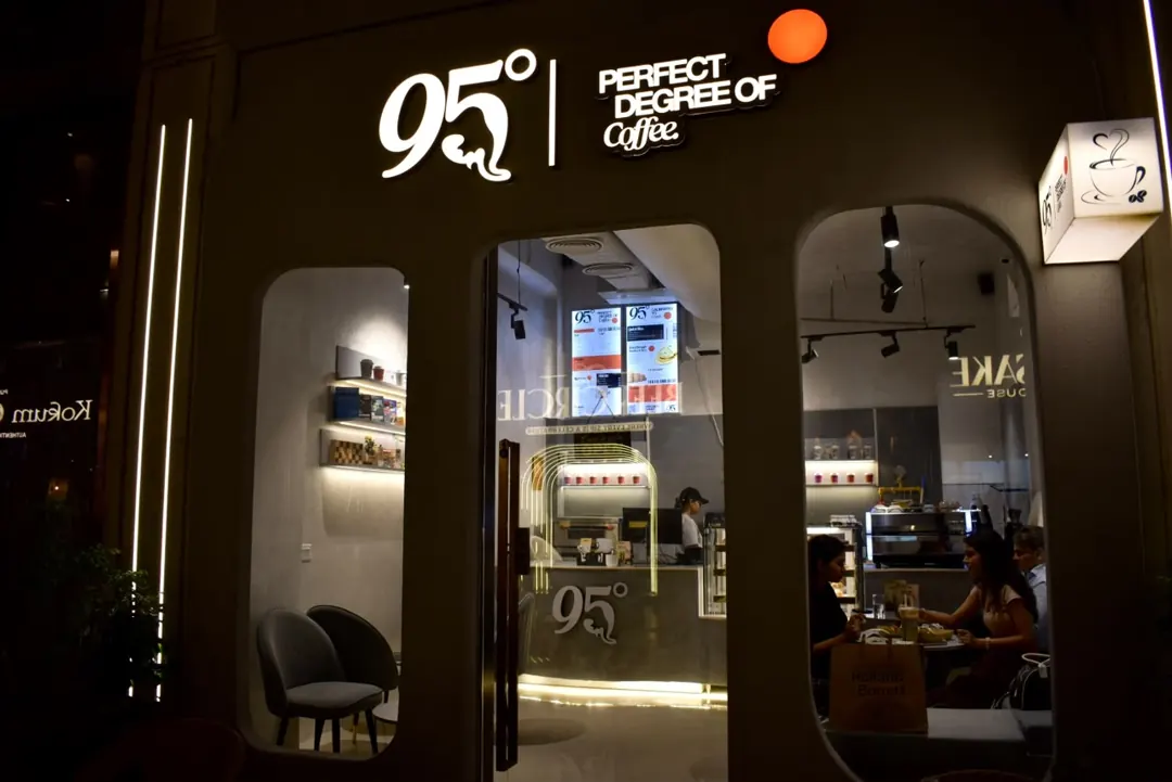 The café at night, lit from inside