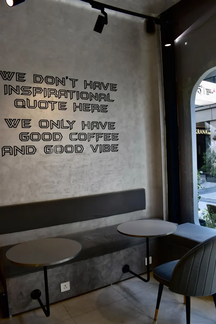 The quote wall above the bench seating